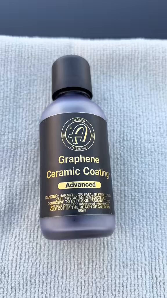 Adam's Graphene Ceramic Coating Advanced bottle on textured surface